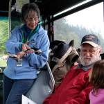 Kylie Beard, 5, tells her grandfather, Tom Beard, what she knows about orcas as Langley Whale Center guide Bonnie Gretz holds a tiny whale. Photos by Patricia Guthrie/Whidbey News Group