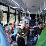 Island Transit tour guide Maribeth Crandell (right) chats with volunteer Bonnie Gretz (left) of the Langley Whale Center during Saturdays ride to the towns whale parade and festival. Almost two dozen people signed up for the round-trip tour. Passengers continue to be picked up at usual stops during the tours.