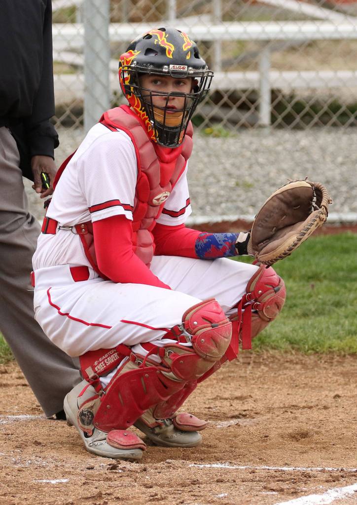 Catcher Gavin Knoblich checks with the bench for the pitch call.(Photo by John Fisken)