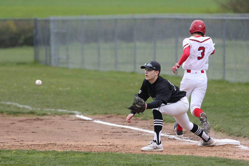 Joey Lippo beats the throw for an infield single as Klahowya Hayden Trull awaits the ball. (Photo by John Fisken)