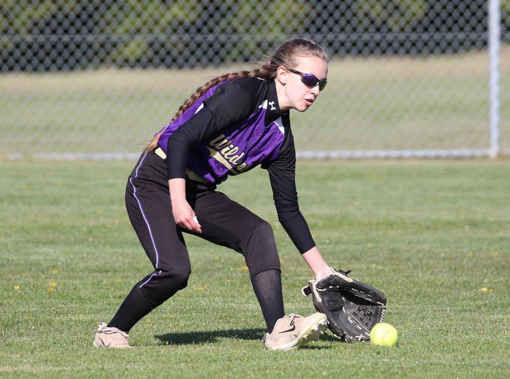 Center fielder Miranda Wilson scoops up an Edmonds-Woodway base hit.(Photo by John Fisken)