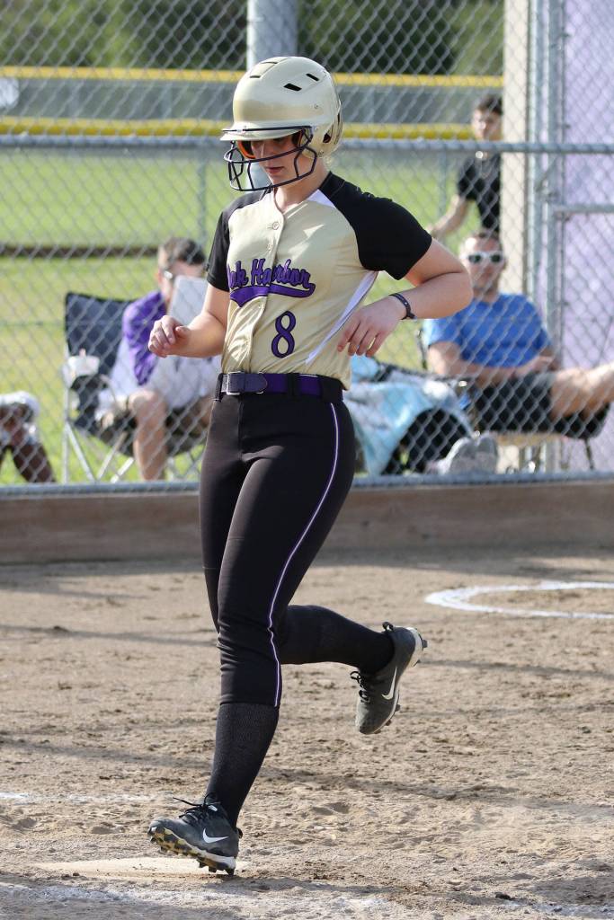 Exchange student Lavinia Liatti gets in on the fun by scoring a run in the win over Shorewood.(Photo by John Fisken)