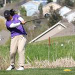 Jenna Flores tees off for the Wildcats.(Photo by John Fisken)
