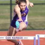 Samatha Hines leaps a hurdle in her comeback win in the 300.(Photo by John Fisken)