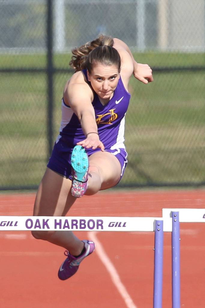 Samatha Hines leaps a hurdle in her comeback win in the 300.(Photo by John Fisken)