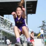 Leielle Salinger flies in the long jump.(Photo by John Fisken)