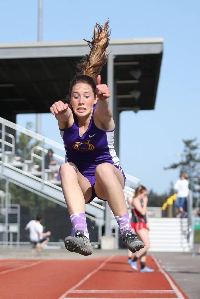 Leielle Salinger flies in the long jump.(Photo by John Fisken)