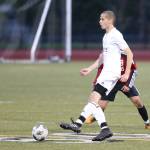 Taylor Jackson looks to pass for the Wildcats.(Photo by John Fisken)