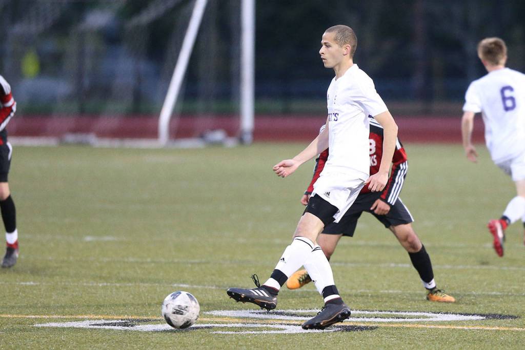 Taylor Jackson looks to pass for the Wildcats.(Photo by John Fisken)