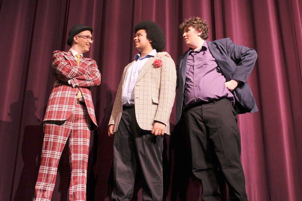 Kenyon Sirak (left) as Benny Southstreet, Gavin Bowman (center) as Harry the Horse and Andrew Piezchala as Big Jule perform in Oak Harbor High Schools prodution of Guys & Dolls through May 12.