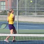 Oak Harbors Maddie McKenzie keeps her eye on the ball in the Arlington match Wednesday. (Photo by Jim Waller/Whidbey News-Times)
