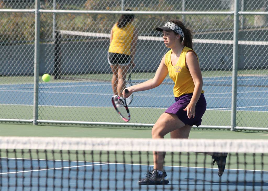 Emma Wezeman returns a shot in her win in second singles Wednesday.(Photo by Jim Waller/Whidbey News-Times)