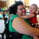 Scott Becktell hugs his nephew, Kenneth. Central Whidbey Hearts & Hammers widened doors and built a shower ramp.