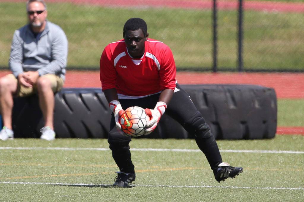 Keeper Dewitt Cole scoops up the ball for the Wolves.(Photo by John Fisken)