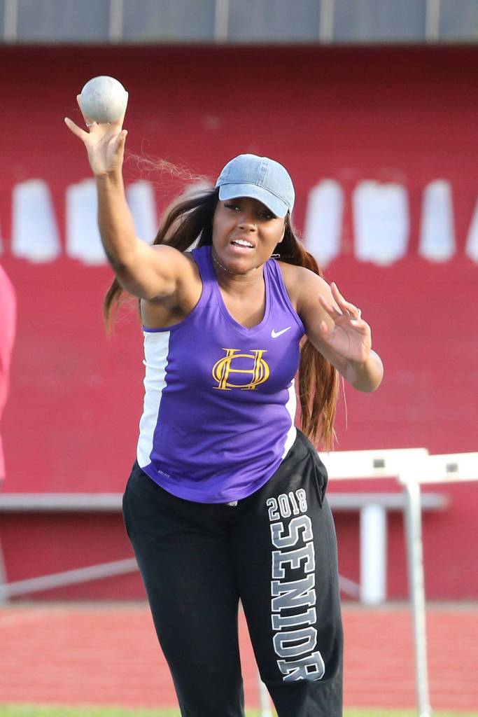 Jhayna Bowie tosses the shot put for Oak Harbor.(Photo by John Fisken)
