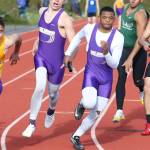 Andrew Miller hands the baton to Dorian Hardin in the 4x100 relay.(Photo by John Fisken)