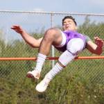 Kyle Nickols clears the bar in Fridays high jump competition.(Photo by John Fisken)