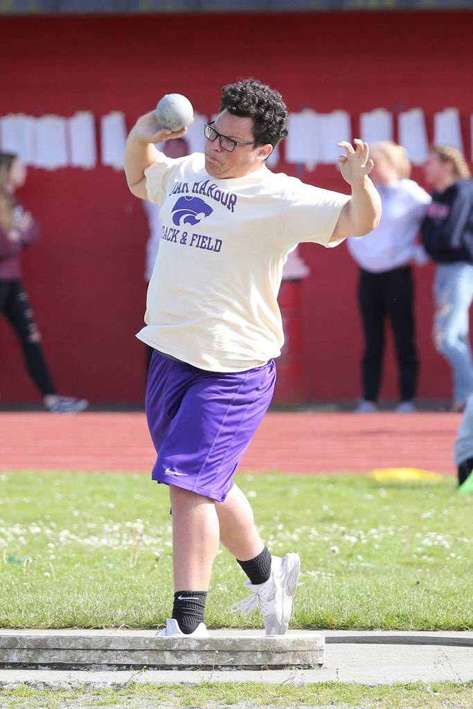 Nathaniel Nunez puts the shot for the Wildcats.(Photo by John Fisken)