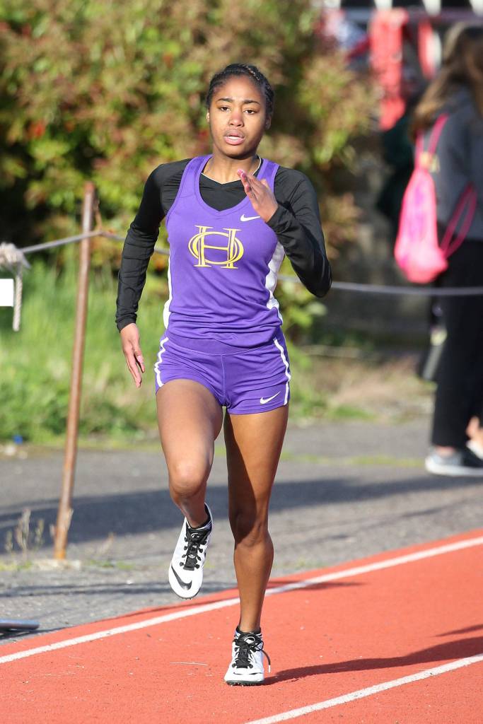 Jessica Vester runs the 400 meters for Oak Harbor.(Photo by John Fisken)