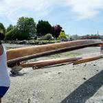 Photo by Maria Matson/Whidbey News-Times                                Janelle Solomon, 12, from the Lummi Nations Ultimate Warrior Canoe Club carries a canoe along with Regina Miller, who is about to participate in the Womans Singles races. See the story on page A9 of todays Whidbey News-Times.