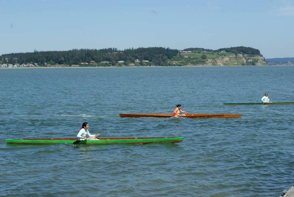 Photo by Maria Matson/Whidbey News-Times                                The Penn Cove Water Festival featured a day-long canoe competition, starting with single-woman races and ending with 11-man races.
