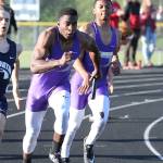 Taeson Hardin takes the baton from his brother Dorian Hardin.(Photo by John Fisken)