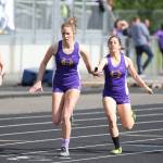 Lieille Salinger takes the baton from Jenna Cooley.(Photo by John Fisken)