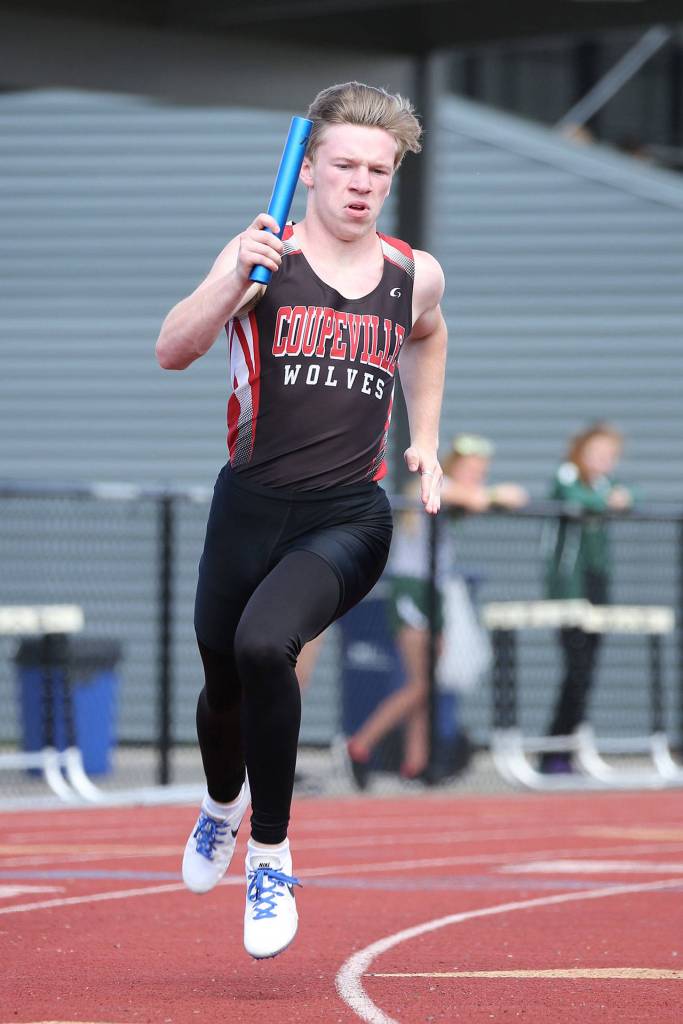 Jacob Smith helped Coupeville win the 4x400 and 4x100 relays in the district meet. (Photo by John Fisken)