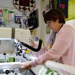 Debra Staley, owner of Quilters Workshop on Pioneer Way, could be displaced if the sale of the land her store is on goes through for a proposed affordable housing development. While not opposed to moving, shes been faced with an unclear future since being notified of the possible sale in January. Photo by Laura Guido/Whidbey News-Times