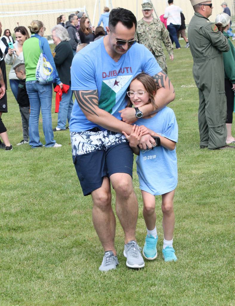 Broad Views Amiya Danielson gets a well-deserved squeeze after finishing the race. (Photo by Jim Waller/Whidbey News-Times)