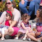 Photo by Joan Soltys / Whidbey News-Times                                Dressed in red, white and blue, young Allie, Paizley and Emmy Hansen of Coupeville were among the many kids who came out to watch the Memorial Day parade.