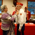 Bob Gabelein gets ready to have his photo taken with Whidbey Island quilter Connie Duddridge.