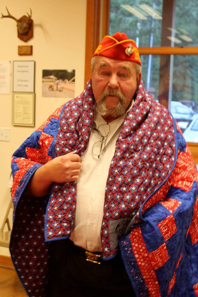 Tom Keltner got chocked up when presented with a quilt with the word Believe sewn in.