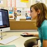 Brenna Rothman, Oak Harbor High School junior, opens her design for the Oak Harbor Poetry Project logo. Hers was chosen out of around 25 submitted by the high school advanced graphic design students. Photo by Laura Guido/Whidbey News-Times