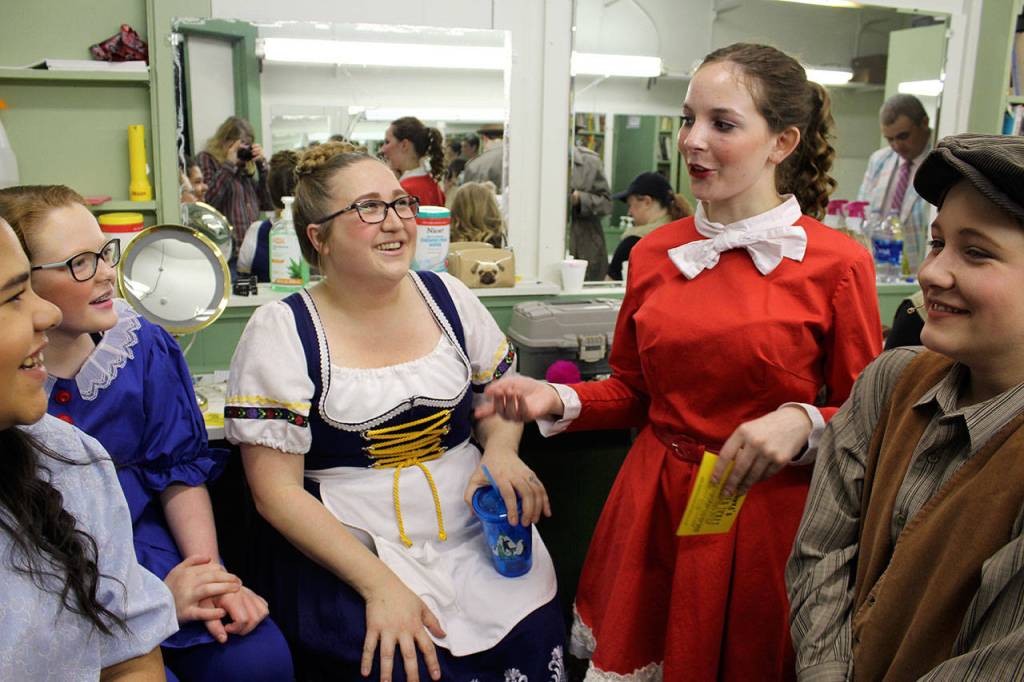 Backstage at Whidbey Playhouse, some of the cast joke around between acts during preview night of Willy Wonka. Left to right are Ameerah Melendrez, Brynn Schmid, Sarah Meyer, Myah Corella and Maggie Garrett.