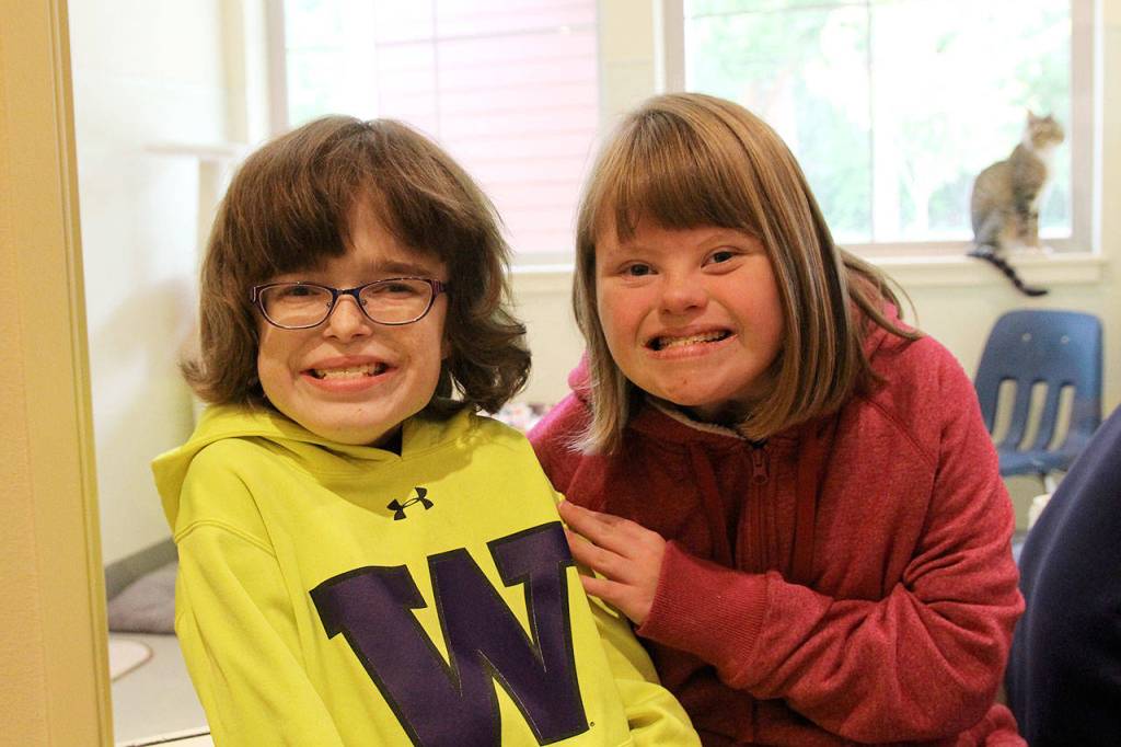 Lydia Vaughan, left, and Courtnee Cox at WAIF Animal Shelter last week. Photo by Laura Guido/Whidbey News Group