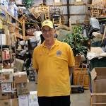 Photo by Maria Matson /Whidbey News Group.                                Coupeville Lions garage sale chairman Brian Pulk stands among piles of merchandise the club has collected in advance of their annual garage sale.