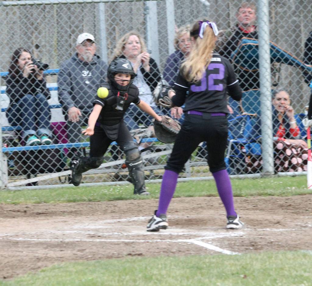 Above, Bat Buster catcher Maya Shoosmith tosses to Reese Wasinger covering home after a wild pitch. Below, Wasinger tags out Keli Aranguir-Plummer for the final out.(Photo by Jim Waller/Whidbey News-Times)