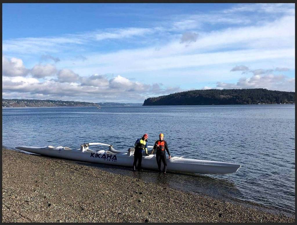 Park, left, and teammate Tanja Reiners are members of the six-person crew that will paddle to Port Townsend. (Photo by Fegus Kanaiaupune Hyke)
