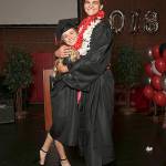 Hope Lodell and Ariah Bepler hug each other on stage.