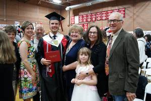 Photos by Maria Matson/Whidbey News-Times                                Luke Carlson, 19, stands with his family. He plans to attend Washington State University to pursue a degree in agricultural education.