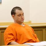 Photo by Jessie Stensland / Whidbey News Group.                                Convicted murderer Joshua Lambert appears bored during a hearing last Friday on a series of his motions. He is acting as his own attorney.