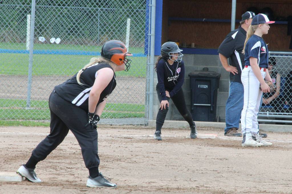 Maya Lucero, left, and Allison Nastali get ready to run for Central Whidbey.(Photo by Jim Waller/Whidbey News-Times)