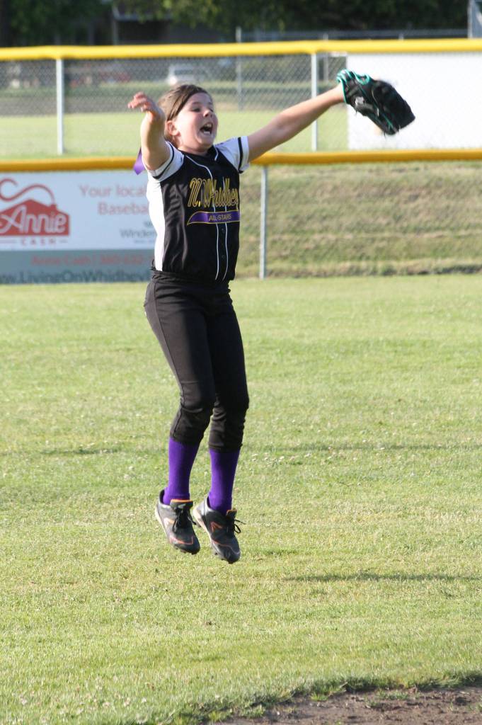 Above, Joelle Hasler celebrates an inning-ending strkeout for North Whidbey. In the series of photos below, Mia Regan reacts to each strike in the top of the sixth inning as North Whidbey closes in on the victory.(Photo by Jim Waller/Whidbey News-Times)