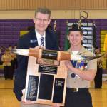 The RADM George Lotzenhiser Take the Bull by the Horns Leadership Award is presented by Dr. Lance Gibbon to Senior Cadet Dylan Sanchez.