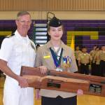 Cadet Lauren Crossley, shown with rifle team coach Lt. Cmdr. Dave Goodman, USN (Ret.), is the first sophomore to receive the Top Gun Marksmanship Award.