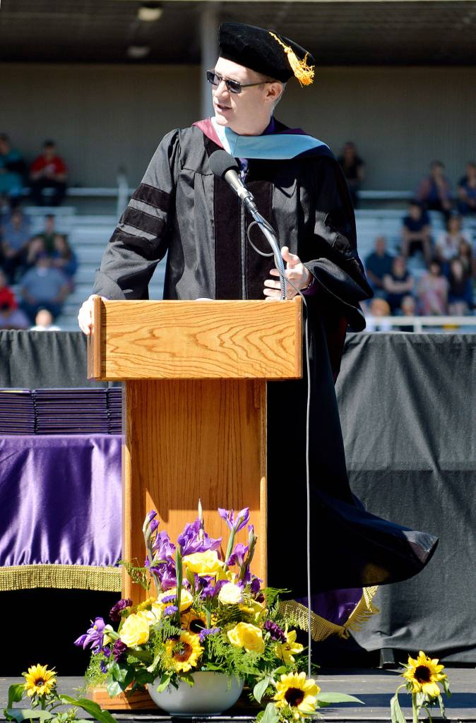 Lance Gibbon, superintendent of Oak Harbor Public Schools, speaks at commencement Saturday afternoon at Wildcat Memorial Stadium. He commended the class of 2018 for their heart for service and ambition to make the world a better place. Photo by Laura Guido/Whidbey News-Times