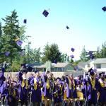 Oak Harbor High School students throw their caps into the air at the end of commencement Saturday. There were 327 graduates. Photo by Laura Guido/Whidbey News-Times