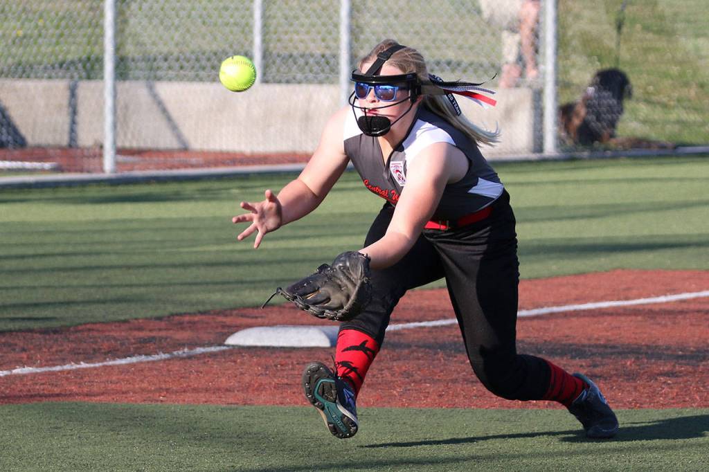 Central Whidbey third baseman Madison McMillan hustles in to grab a pop-up.(Photo by John Fisken)