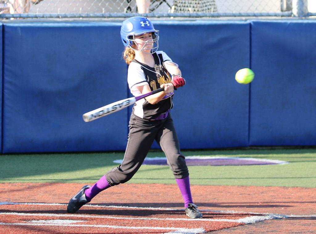Maya Shoosmith singles for a North Whidbey base hit.(Photo by John Fisken)